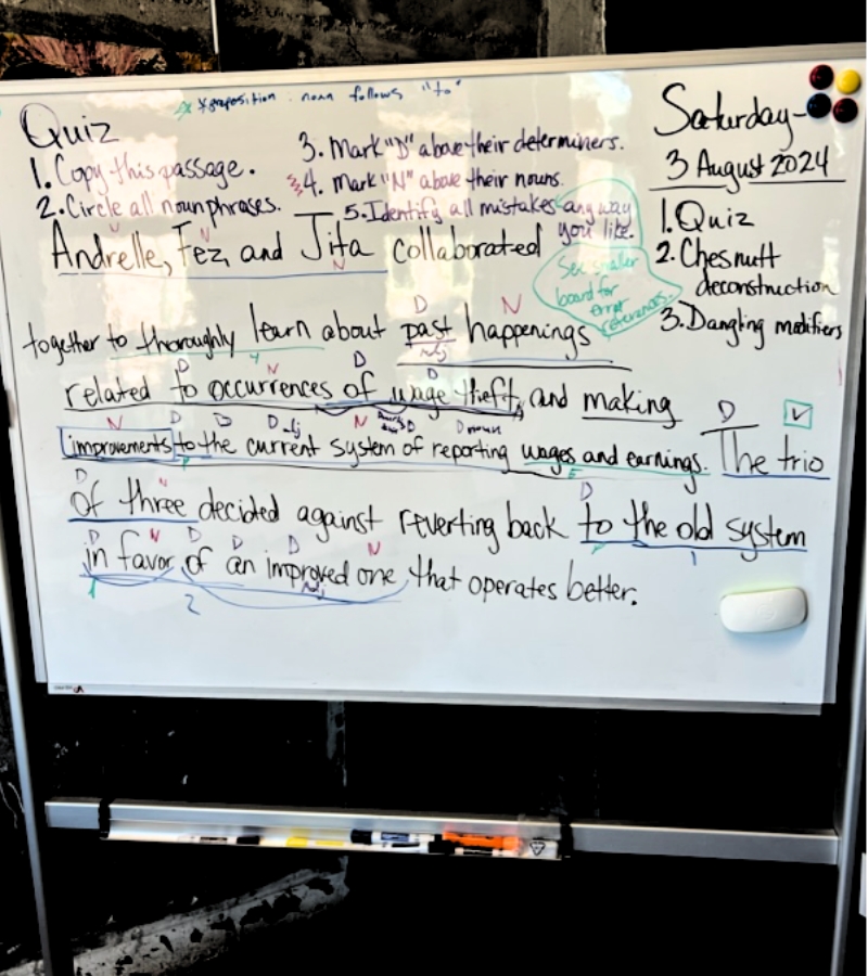 a white board with writing on it during a grammar lesson